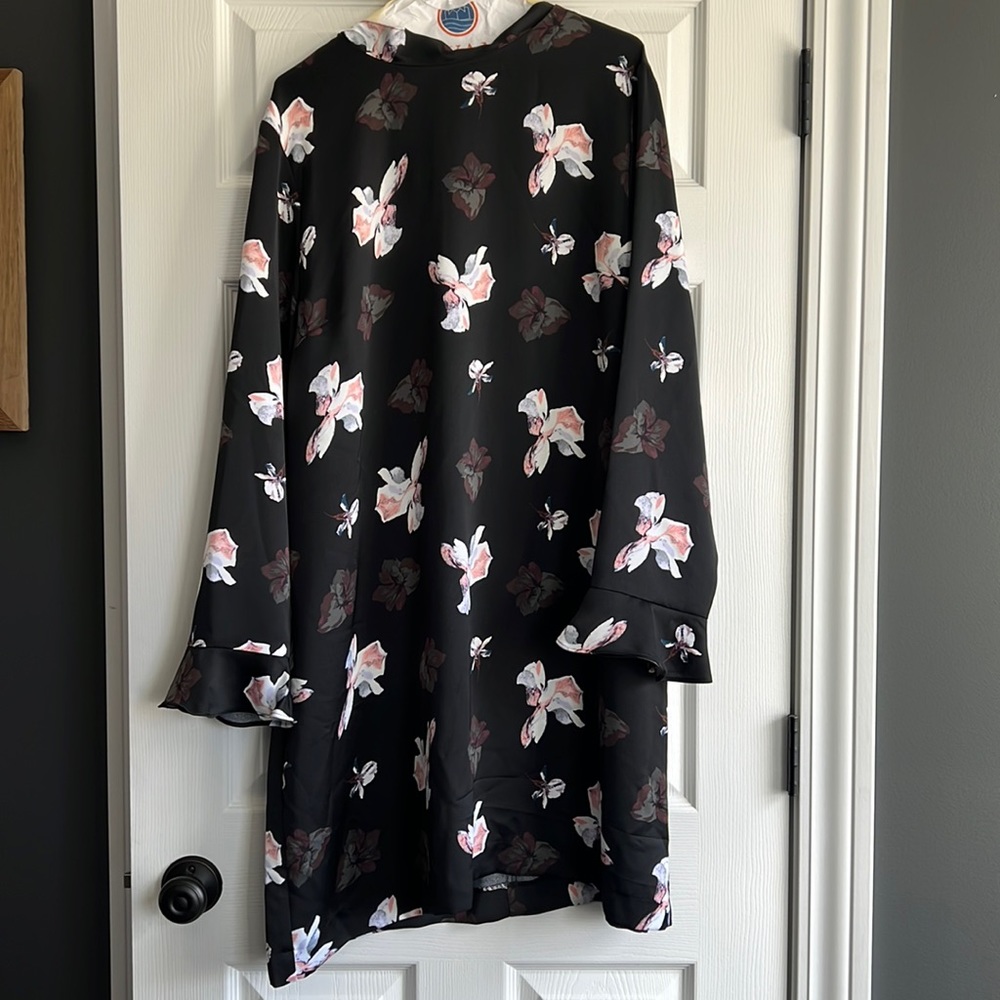 Black, floral mid length dress.